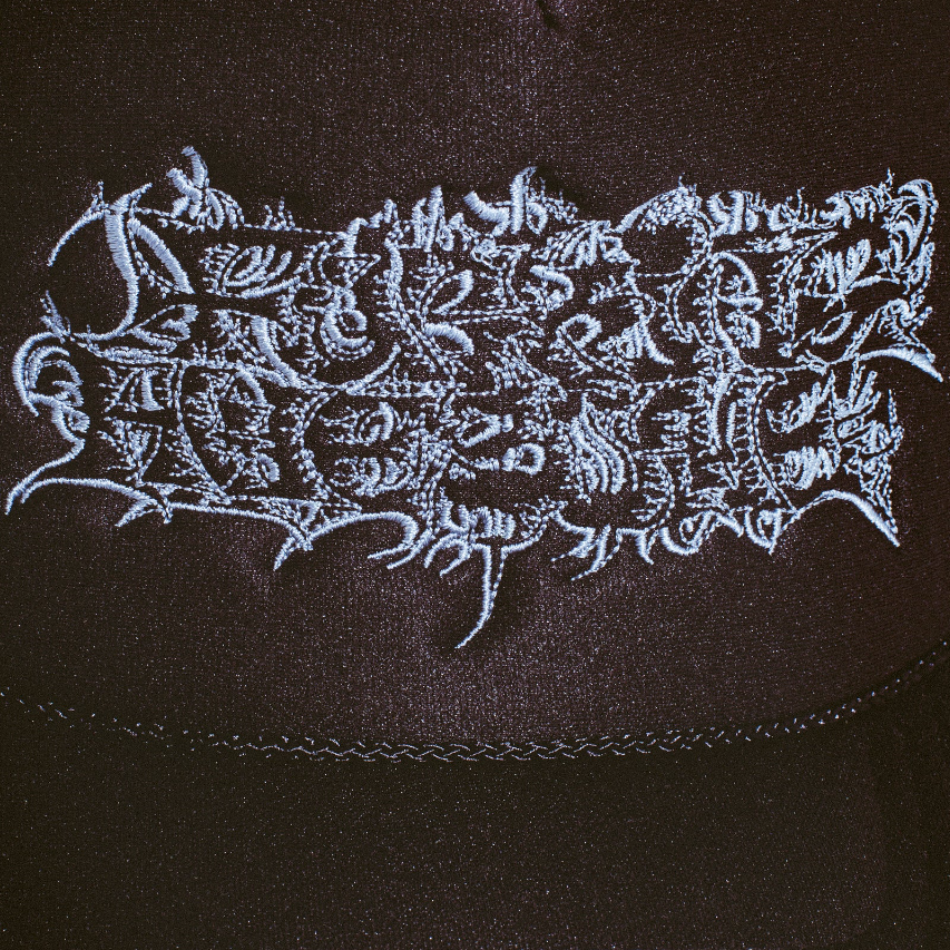2025_FA_Summer_GraphicDetail_Hats_SavieTrucker_Black_Detail1-Photoroom.png
