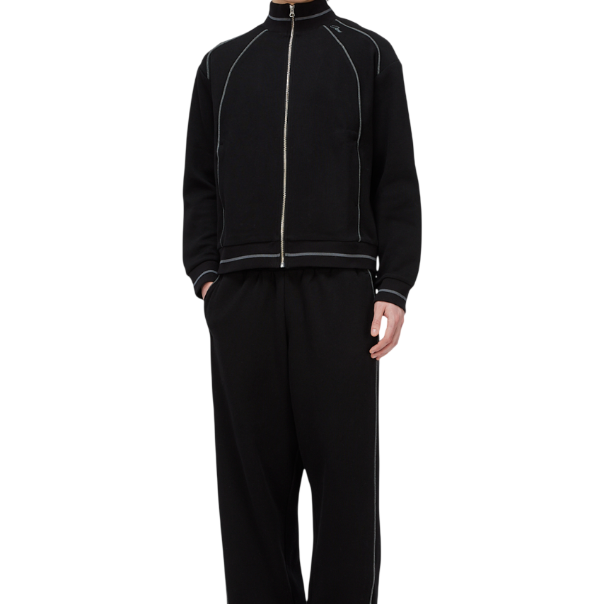 BOTTOMS_SP26_TRACKPANTS_BLACK_MODEL_1-Photoroom.png