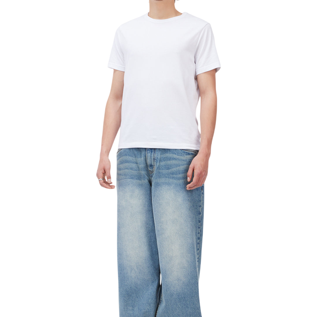 Bottoms_SU26_BaggyDenimPants_SandblastedIndigo_Model_01-Photoroom.png