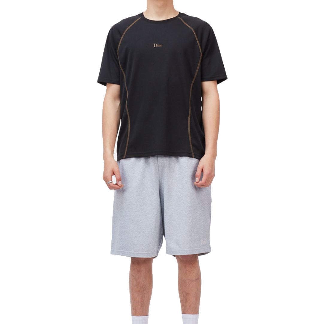 Tops_SU26_TrainingJersey_Black_Model_01_shopify_white.png